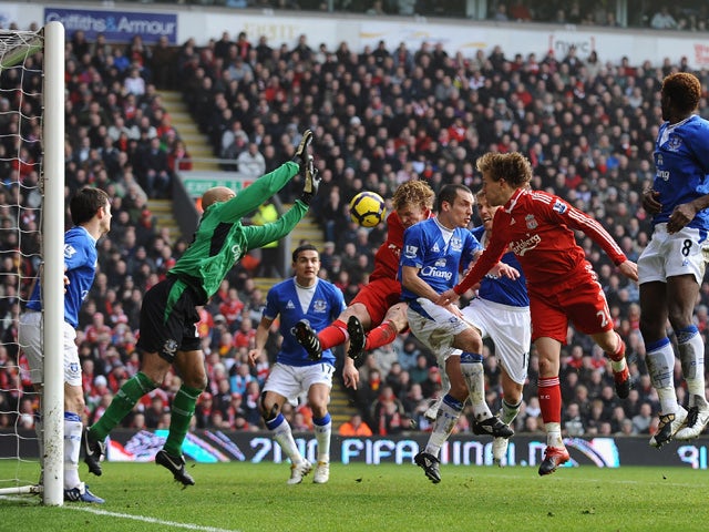 Dirk Kuyt of Liverpool scores the opening goal during the Barclays Premier League match between Liverpool and Everton at Anfield on February 6, 2010