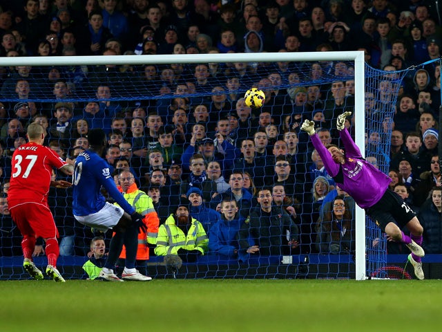 Simon Mignolet of Liverpool makes a save during the Barclays Premier League match between Everton and Liverpool at Goodison Park on February 7, 2015