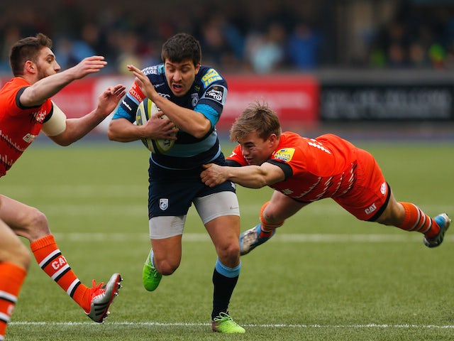 Lucas Amorosino of Cardiff is tackled by Jack Roberts (R) and Owen Williams (L) of Leicester during the LV= Cup match between Cardiff Blues and Leicester Tigers on February 7, 2015