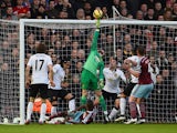 David De Gea of Manchester United makes a save from Enner Valencia of West Ham during the Barclays Premier League match between West Ham United and Manchester United at Boleyn Ground on February 8, 2015