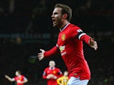 Juan Mata of Manchester United celebrates scoring the opening goal during the FA Cup Fourth round replay match between Manchester United and Cambridge United at Old Trafford on February 3, 2015