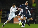 Lyon's French midfielder Maxime Gonalons (L) vies with Paris Saint-Germain's Swedish midfielder Zlatan Ibrahimovic (R) during the French L1 football match on February 8, 2015