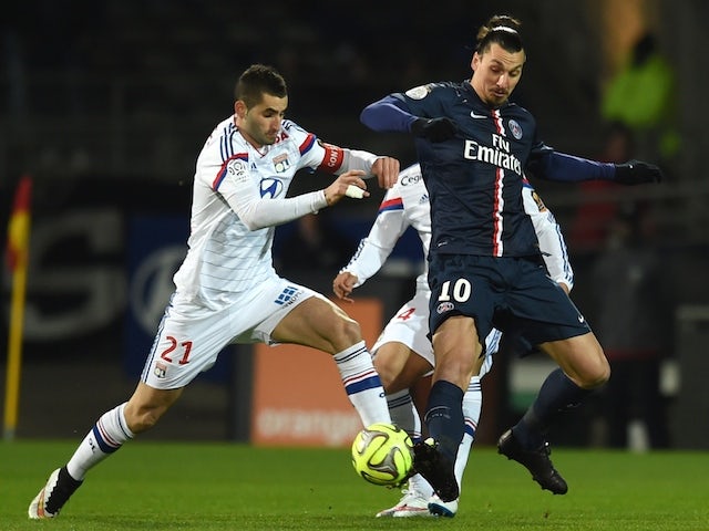 Lyon's French midfielder Maxime Gonalons (L) vies with Paris Saint-Germain's Swedish midfielder Zlatan Ibrahimovic (R) during the French L1 football match on February 8, 2015