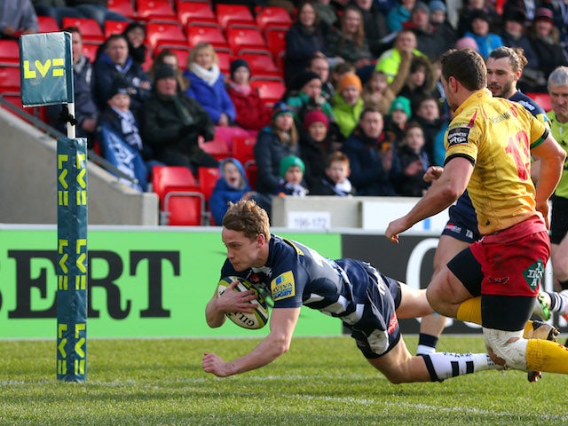 Michael Haley of Sale Sharks crosses the line to score a try during the LV Cup match between Sale Sharks and Scarlets at the AJ Bell stadium on February 7, 2015