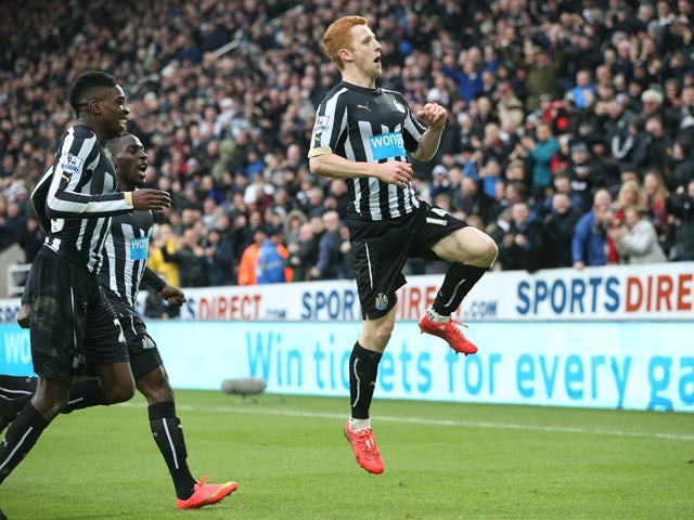 Newcastle United's English midfielder Jack Colback celebrates with Newcastle United's English striker Sammy Ameobi and Newcastle United's French defender Massadio Haidara after he scores the opening goal of the English Premier League football match betwee