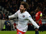 Paris Saint-Germain's Brazilian defender Maxwell celebrates after scoring a goal during the French League Cup football match Lille vs PSG on February 3, 2015