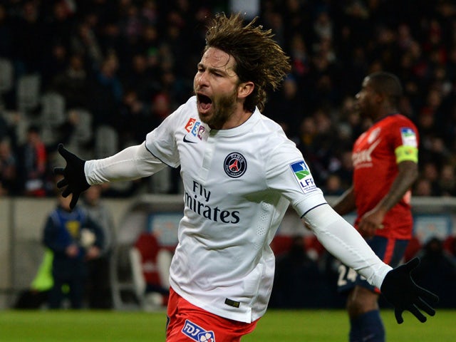 Paris Saint-Germain's Brazilian defender Maxwell celebrates after scoring a goal during the French League Cup football match Lille vs PSG on February 3, 2015