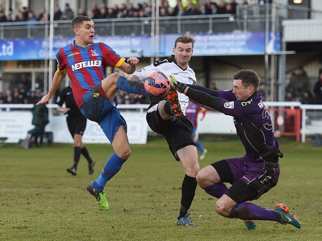 Tom Bonner and Andrew Rafferty of Dover block a shot by Stuart O'Keefe of Palace during the FA Cup Third Round match between Dover Athletic and Crystal Palace on January 4, 2015