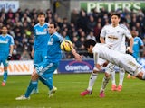  Swansea City player Ki Sung-Yueng dives to head the first Swansea goal during the Barclays Premier League match between Swansea City and Sunderland at Liberty Stadium on February 7, 2015
