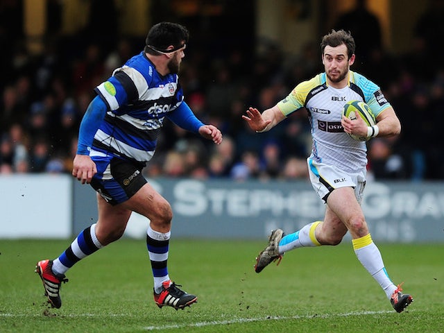 Tom Grabham of Ospreys takes on Rob Webber of Bath during the LV= Cup match between Bath Rugby and Ospreys at Recreation Ground on February 7, 2015