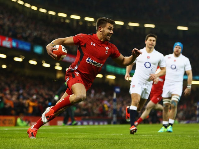 Rhys Webb of Wales goes over to score the opening try during the RBS Six Nations match between Wales and England at the Millennium Stadium on February 6, 2015