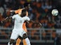 Ivory Coast's forward Wilfried Bony (back) challenges Ghana's defender Jonathan Mensah during the 2015 African Cup of Nations final football match on February 8, 2015