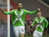 Wolfsburg's forward Bas Dost of the Netherlands celebrates scoring the opening goal during the German first division Bundesliga football match VfL Wolfsburg vs 1899 Hoffenheim in Wolfsburg, central Germany, on February 7, 2015