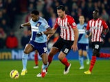 Alexandre Song of West Ham runs with the ball under pressure from Graziano Pelle of Southampton during the Barclays Premier League match on February 11, 2015