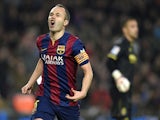 Barcelona's midfielder Andres Iniesta celebrates after scoring a goal during the Spanish Copa del Rey (King's Cup) semifinal first leg football match against Villarreal on February 11, 2015