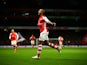 Theo Walcott of Arsenal celebrates after scoring his team's second goal during the Barclays Premier League match between Arsenal and Leicester City at Emirates Stadium on February 10, 2015