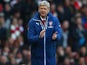 Arsenal manager Arsene Wenger applauds while wearing his ridiculously oversized coat on February 15, 2015