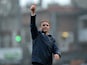 Bradford City's English manager Phil Parkinson gestures to the supporters after the FA Cup fifth round football match between Bradford City and Sunderland at The Coral Windows Stadium in Bradford, northern England on February 15, 2015