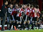 Andre Gray of Brentford FC celebrates scoring the first goal with Mark Warburton Manager of Brentford FC during the Sky Bet Championship match between Brentford and Watford at Griffin Park on February 10, 2015