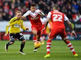 Jordan Cousins of Brentford shakes off the challenge of Alex Pritchard of Charlton Athletic during the Sky Bet Championship match between Charlton Athletic and Brentford at The Valley on February 14, 2015