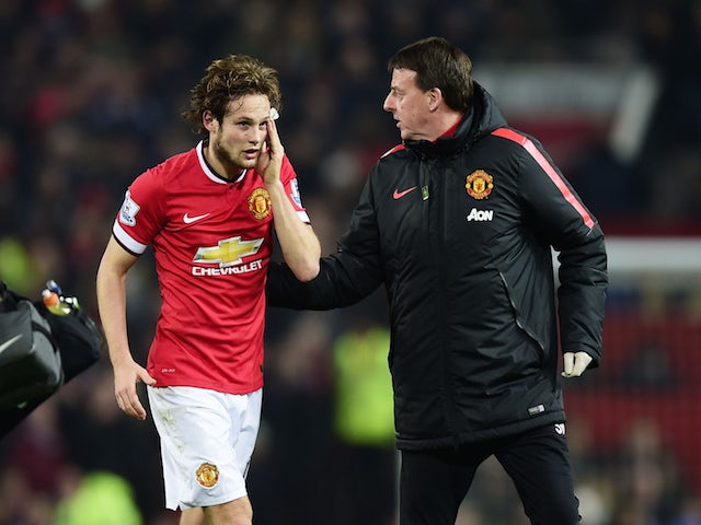 Daley Blind of Manchester United leaves the field for treatment during the Barclays Premier League match against Burnley on February 11, 2015