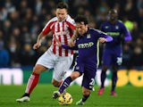 David Silva of Manchester City battles for the ball with Marko Arnautovic of Stoke City during the Barclays Premier League match on February 11, 2015
