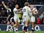 England's centre Jonathan Joseph (R) celebrates scoring his second try during the Six Nations international rugby union match between England and Italy at Twickenham Stadium in south west London on February 14, 2015