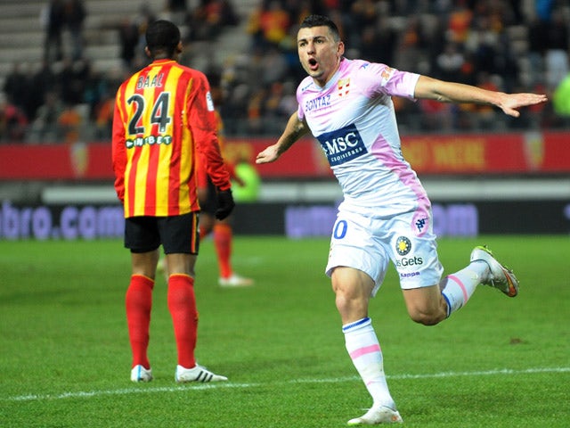 Evian's French forward Mathieu Duhamel jubilates after scoring during the French L1 football match between Lens and Evian Thonon on February 14, 2015