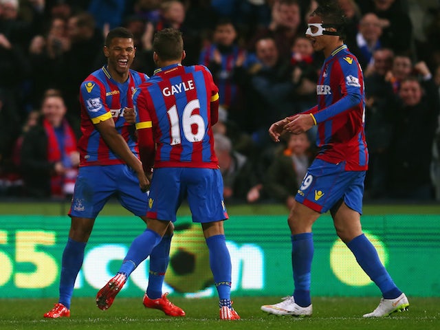 Fraizer Campbell of Crystal Palace (L) celebrates scoring the opening goal with Dwight Gayle and Marouane Chamakh during the FA Cup fifth round match against Liverpool on February 14, 2015