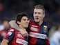 Diego Perotti with his teammate Juraj Kucka of Genoa CFC celebrates after scoring the opening goal from penalty spot during the Serie A match between SS Lazio and Genoa CFC at Stadio Olimpico on February 9, 2015