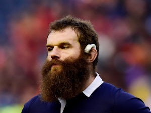 Cross shaves off charity beard