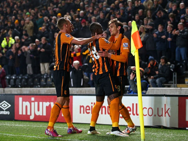 Nikica Jelevic of Hull City is congratulated by teammates Dame N'Doye and David Meyler of Hull City after scoring the opening goal during the Barclays Premier League match between Hull City and Aston Villa at the KC Stadium on February 10, 2015