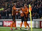 Nikica Jelevic of Hull City is congratulated by teammates Dame N'Doye and David Meyler of Hull City after scoring the opening goal during the Barclays Premier League match between Hull City and Aston Villa at the KC Stadium on February 10, 2015