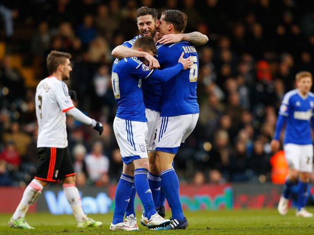Daryl Murphy of Ipswich Town (C) celebrates with teammates Freddie Sears (L) and Christophe Berra (R) after scoring his second goal during the Sky Bet Championship match between Fulham and Ipswich Town at Craven Cottage on February 14, 2015