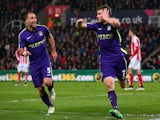 James Milner of Manchester City celebrates with team-mate Pablo Zabaleta after scoring his team's second goal during the Barclays Premier League match against Stoke on February 11, 2015