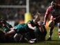Sam Harrison of Leicester dives to pass during the Aviva Premiership match between Leicester Tigers and Gloucester Rugby at Welford Road on February 13, 2015