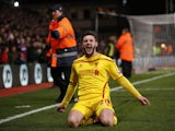 Liverpool's English midfielder Adam Lallana celebrates after scoring their second goal to take the lead 2-1 during the English FA Cup fifth round football match between Crystal Palace and Liverpool at Selhurst Park in south London on February 14, 2015