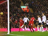 Mario Balotelli of Liverpool scores during the Barclays Premier League match between Liverpool and Tottenham Hotspur at Anfield on February 10, 2015