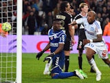 Marseille's Ghanaian forward Andre Ayew (R) celebrates after scoring a goal during the French L1 football match Marseille vs Reims at Velodrome stadium in Marseille, southern France, on February 13, 2015