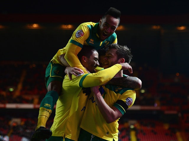 Jonathan Howson of Norwich celebrates scoring the opening goal with team mates during the Sky Bet Championship match between Charlton Athletic and Norwich City at The Valley on February 10, 2015