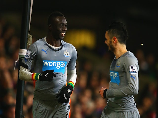Papiss Cisse of Newcastle United celebrates scoring the opening goal with Remy Cabella of Newcastle United during the Barclays Premier League match against Crystal Palace on February 11, 2015