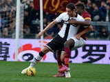 Parma's forward from Algeria Ishak Belfodil fights for the ball with Roma's defender from France Mapou Yanga-Mbiwa during the Italian Serie A football match AS Roma vs Parma at the Olympic stadium in Rome on February 15, 2015