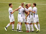 Perth Glory players celebrate after scoring during round 17 A-League match between Adelaide United and Perth Glory at Coopers Stadium on February 15, 2015