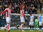 Stoke City's English striker Peter Crouch (C) celebrates scoring the opening goal of the English FA Cup fifth round football match against Blackburn Rovers on February 14, 2015