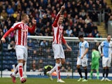Stoke City's English striker Peter Crouch (C) celebrates scoring the opening goal of the English FA Cup fifth round football match against Blackburn Rovers on February 14, 2015