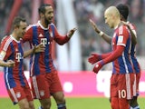 Bayern Munich's Rafinha, Mehdi Benatia, Arjen Robben and David Alaba celebrate a goal against Hamburg on February 14, 2015