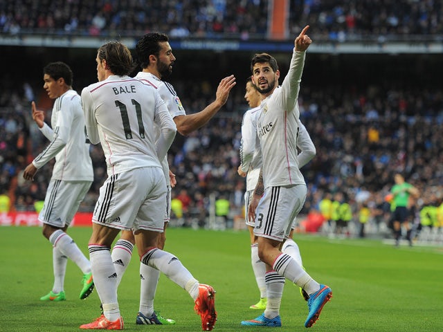 Isco of Real Madrid celebrates after scoring Real's opening goal during the La Liga match between Real Madrid CF and RC Deportivo La Coruna at Estadio Santiago Bernabeu on February 15, 2015