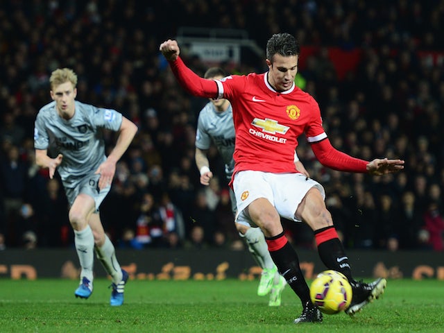 Robin van Persie of Manchester United scores from the penalty spot during the Barclays Premier League match against Burnley on February 11, 2015