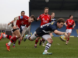 Will Addison of Sale dives over to score a try during the Aviva Premiership match between London Welsh and Sale Sharks at Kassam Stadium on February 15, 2015