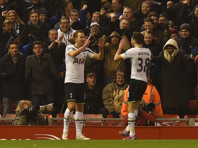 Tottenham Hotspur's English striker Harry Kane celebrates scoring their first goal to equalise 1-1 during the English Premier League football match between Liverpool and Tottenham Hotspur at the Anfield stadium in Liverpool, northwest England, on February